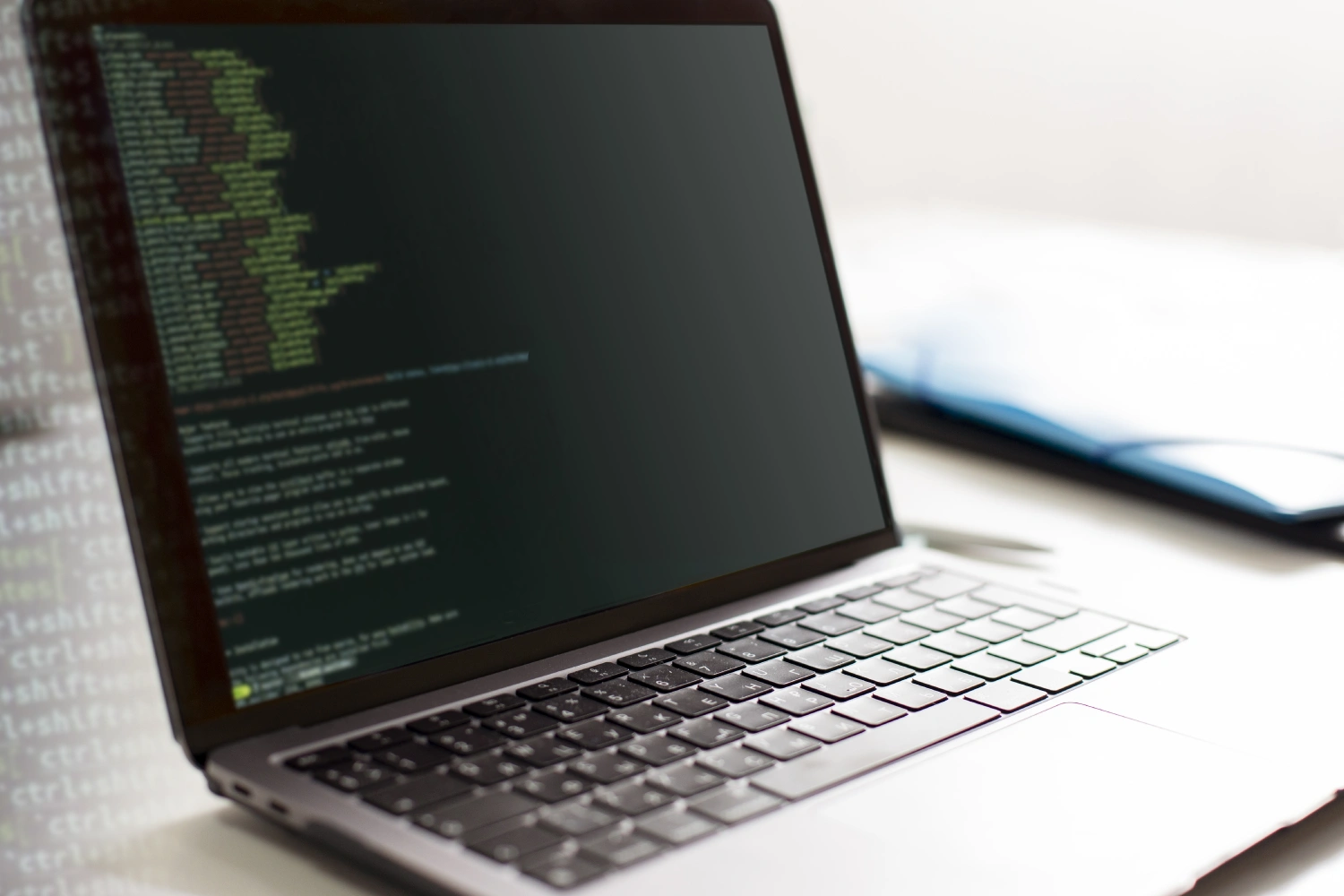 Laptop screen displaying code for computer-assisted translation tools.