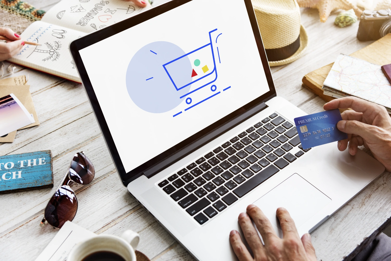E-commerce translation services—laptop with shopping cart icon and credit card